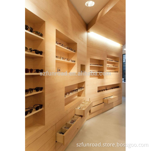 Customized eyewear retail store laminated wooden fixtures with wood grains illuminated sunglasses display cases